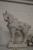 A white glazed pottery Tang style model of a horse.