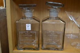 A pair of glass scent bottles.