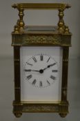 A brass carriage clock.