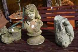 A reconstituted stone garden ornament modelled as a bust of a young lady together with two other