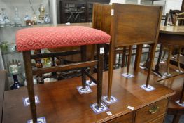 A stool and a magazine rack.