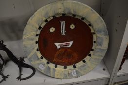 A large Picasso style decorated circular dish.