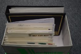 A box containing Guernsey and Alderney first day covers etc.