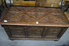 A carved oak blanket box.