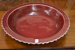 A good large Chinese sang de boeuf circular dish with wavy rim.