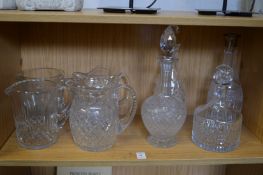 Cut glass jugs and decanters.