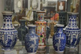 Two pairs of Chinese blue and white vases and a famille rose vase.