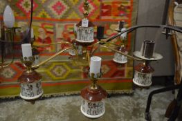 A decorative chandelier with Egyptian revival decoration.