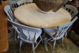 A pine and painted pine circular pedestal breakfast table together with a set of six matching