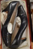 A pair of Salvatore Ferragamo black leather shoes, size 38.5, boxed.