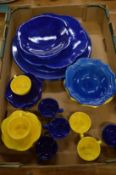 A collection of Maryse Boxer blue and yellow glazed china.