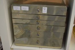A small steel dentists cabinet.