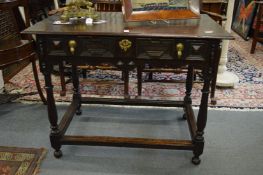 A good 18th century oak side table with a single drawer on turned supports united by stretchers.