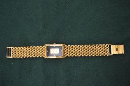 A gentleman's gilt metal wristwatch, the dial mounted with a fine gold ingot.