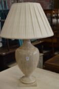 A large marble table lamp.
