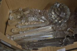 A small box cut glass chandelier parts.