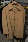 A Valentino ladies beige overcoat size 40.