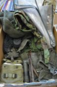 A quantity of army fatigues and accessories.