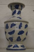 Chinese blue and white vase decorated with butterflies.