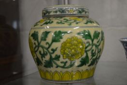 A Chinese famille jaune ginger jar and cover.