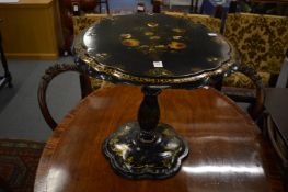 A Victorian papier mache pedestal table.