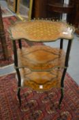 A marquetry and ormolu mounted three-tier etagere.