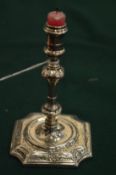 An early Georgian silver taper stick.
