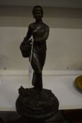 A good Japanese bronze depicting a young lady with a basket on her side, cast with seal mark and