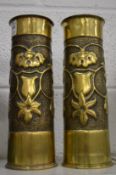 A pair of first World War trench art brass shell cases.