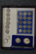 Collectors coins, a coin bracelet and a silver key ring.