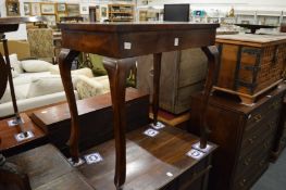 A mahogany occasional table.