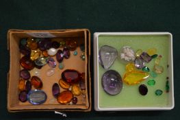 Two small boxes of semi precious stones.