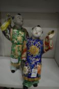 A Japanese satsuma figure of two young boys (some slight damage and repairs).
