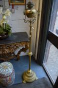 A Victorian brass telescopic floor standing oil lamp.