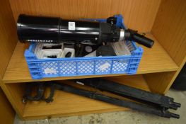 A telescope with tripod stand.