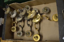 A set of four brass two branch wall lights.