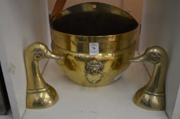 A brass wall mounted jardiniere and a pair of brass duck ends.