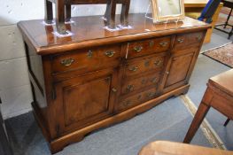 A good reproduction oak dresser base.