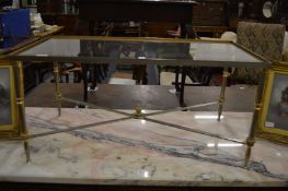 A stylish glass and metal rectangular coffee table.