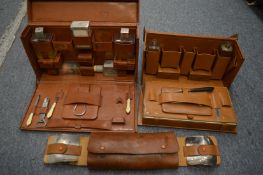 Three gentleman's leather travelling cases.