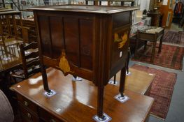An unusual mahogany and inlaid trolley/cabinet with a deep drawer running through the centre.