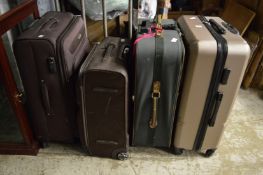 Four modern suitcases.