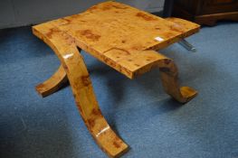 An unusual burr wood Art Deco style coffee table.