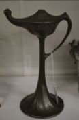 An Art Nouveau pewter oil lamp.