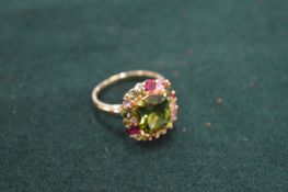 A gem set and gilded fashion ring.