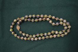 A cloisonne bead necklace.