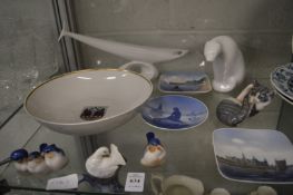 A collection of Copenhagen porcelain together with a Royal Dux polar bear and fish.