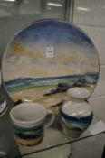 A Highland Stoneware seascape plate and two other items.