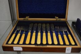 A cased set of six fish knives and forks.