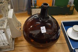 A large amethyst glass bottle.